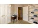 Office nook featuring built-in shelves, storage, and a workspace at 216 Harvester Dr, Holly Springs, NC 27540
