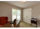 Office area with desk and chair in cozy, naturally lit bedroom at 216 Harvester Dr, Holly Springs, NC 27540