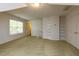 Bright bonus room with ample natural light, built-in shelving, and plenty of carpeted space at 216 Harvester Dr, Holly Springs, NC 27540
