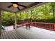 Cozy covered deck with outdoor seating and views of a lush backyard at 216 Harvester Dr, Holly Springs, NC 27540