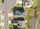 An aerial perspective showcases a home with a manicured lawn and a patio area, with neighborhood views at 218 Maple Walk St, Durham, NC 27703