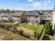 A large, fenced backyard features a patio, grill, seating, and a well-kept lawn area at 218 Maple Walk St, Durham, NC 27703
