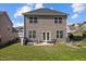 Well-maintained backyard featuring a patio, grilling area, and lush lawn perfect for outdoor enjoyment at 218 Maple Walk St, Durham, NC 27703