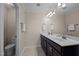 Elegant bathroom boasting a double sink vanity with modern fixtures and ample counter space at 218 Maple Walk St, Durham, NC 27703
