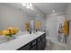 Stylish bathroom featuring a sleek vanity, a large mirror, and a shower-tub combination with floral accents at 218 Maple Walk St, Durham, NC 27703