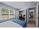 Bedroom with a window seat, comfortable bed, adjacent closet and access to other rooms at 218 Maple Walk St, Durham, NC 27703