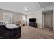 Comfortable bonus room features neutral colors, large windows, and space for entertainment and relaxation at 218 Maple Walk St, Durham, NC 27703