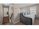 Upstairs bonus room features a daybed, decor pillows, and access to upstairs landing and bedrooms at 218 Maple Walk St, Durham, NC 27703