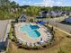 A community pool area boasts lounge chairs, umbrellas, and a well-maintained swimming space at 218 Maple Walk St, Durham, NC 27703