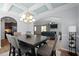 Stylish dining room showing sightlines into the bright living room and kitchen at 218 Maple Walk St, Durham, NC 27703