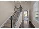 Elegant foyer with hardwood floors, a staircase with iron railings, and ample natural light at 218 Maple Walk St, Durham, NC 27703