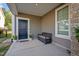 Inviting front porch featuring a dark bench, a window, and a welcoming entryway at 218 Maple Walk St, Durham, NC 27703