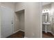 Hallway and half bath featuring a door leading outside and pedestal sink at 218 Maple Walk St, Durham, NC 27703