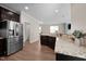This kitchen is designed with stainless steel appliances and granite countertops at 218 Maple Walk St, Durham, NC 27703