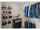 Well-organized walk-in closet providing ample storage with shelving, drawers, and hanging space at 218 Maple Walk St, Durham, NC 27703