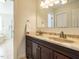 Elegant bathroom featuring dual sinks, granite countertops, and a well-lit mirror at 2213 Ravens Creek Ct, Raleigh, NC 27603