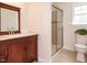 Bathroom featuring a vanity and sink and a glass-door shower at 2213 Ravens Creek Ct, Raleigh, NC 27603