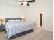 Spacious bedroom with neutral carpet, a large bed, and ample natural light at 2213 Ravens Creek Ct, Raleigh, NC 27603