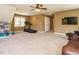Bonus room with large windows, carpet, a treadmill, and plenty of space at 2213 Ravens Creek Ct, Raleigh, NC 27603