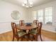 Cozy dining room featuring a wooden table with seating for four and ample natural light at 2213 Ravens Creek Ct, Raleigh, NC 27603