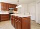 Beautiful kitchen island featuring sleek countertops, cabinet storage, and modern lighting at 2213 Ravens Creek Ct, Raleigh, NC 27603