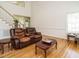 Spacious living room with hardwood floors, high ceilings, and comfortable seating at 2213 Ravens Creek Ct, Raleigh, NC 27603