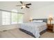 Serene main bedroom with vaulted ceilings, large windows, and a calming color palette at 2213 Ravens Creek Ct, Raleigh, NC 27603