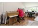 Bright office space with hardwood floors, a desk, and natural light from a large window at 2213 Ravens Creek Ct, Raleigh, NC 27603
