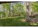 Expansive backyard features lush lawn and mature trees, perfect for outdoor activities and relaxation at 2221 Dungiven Ct, Garner, NC 27529