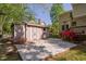 Backyard shed with an adjacent concrete pad, situated near the main house at 2221 Dungiven Ct, Garner, NC 27529