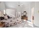 Spacious bedroom featuring neutral paint, ceiling fan, plush carpet and doorway to bath at 2221 Dungiven Ct, Garner, NC 27529