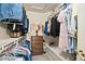 Spacious walk-in closet with ample storage, hanging racks, shelves, and a built-in bench at 2221 Dungiven Ct, Garner, NC 27529