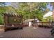 Wide angle shot of a wooden deck featuring a pergola bench and shed at 2221 Dungiven Ct, Garner, NC 27529