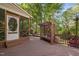 Spacious wooden deck featuring a screened porch, a pergola bench, and views of the backyard at 2221 Dungiven Ct, Garner, NC 27529