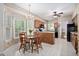 Charming dining area features a wooden table, chandelier, and natural light at 2221 Dungiven Ct, Garner, NC 27529