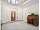 Grand foyer with high ceilings, hardwood floors, and a striking staircase at 2221 Dungiven Ct, Garner, NC 27529