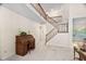 Open foyer area showcases a staircase, high ceilings, and a wooden rolltop desk at 2221 Dungiven Ct, Garner, NC 27529