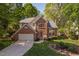 Charming two-story brick home with a well-manicured lawn and an attached two-car garage at 2221 Dungiven Ct, Garner, NC 27529