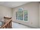Upstairs hallway with large window letting in lots of natural light at 2221 Dungiven Ct, Garner, NC 27529