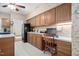 Spacious kitchen and desk area with wooden cabinets and modern appliances at 2221 Dungiven Ct, Garner, NC 27529