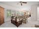 Cozy living area with large windows, hardwood floors, and an open view to the kitchen at 2221 Dungiven Ct, Garner, NC 27529
