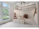 Bright living room with two-story ceiling, large windows, staircase, and comfortable seating at 2221 Dungiven Ct, Garner, NC 27529