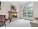 Inviting living room features a classic brick fireplace, large windows, and natural light at 2221 Dungiven Ct, Garner, NC 27529