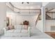 Spacious living room showcases a high ceiling, wooden staircase, and a cozy seating area at 2221 Dungiven Ct, Garner, NC 27529