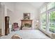 Inviting living room features a classic brick fireplace, large windows, and natural light at 2221 Dungiven Ct, Garner, NC 27529