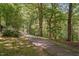 Winding path through a tranquil wooded area, perfect for peaceful strolls and enjoying nature at 2221 Dungiven Ct, Garner, NC 27529
