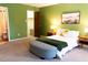 Spacious bedroom with an ensuite bathroom, a walk-in closet, and green walls at 26 Stonewall Way, Durham, NC 27704