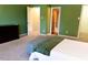 Well-lit bedroom with access to a walk-in closet and ensuite bathroom at 26 Stonewall Way, Durham, NC 27704