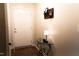 Bright entryway featuring a white door, decorative table, and charming accents at 26 Stonewall Way, Durham, NC 27704