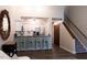 Open-concept kitchen featuring white cabinets, granite countertops, and stairs access at 26 Stonewall Way, Durham, NC 27704